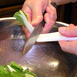 With The Knife On The Right Hand, Twist Wrist To Break The Bok Choy Into Pieces (25k)