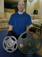 I'm Posing With Two Weight Plates And Exercise Mat